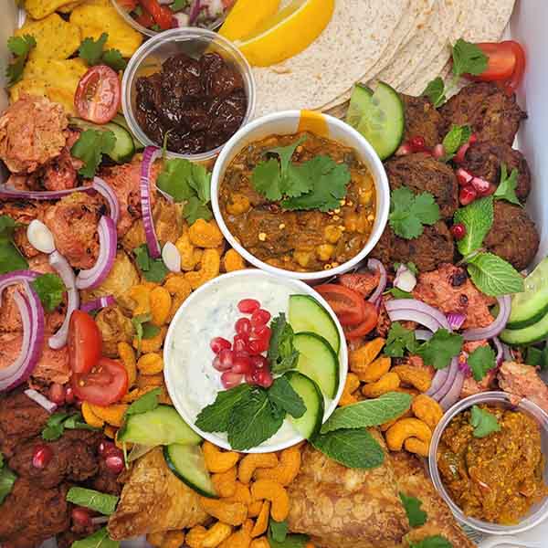 Indian grazing table custom arranged for event catering by Gourmet Grazing
